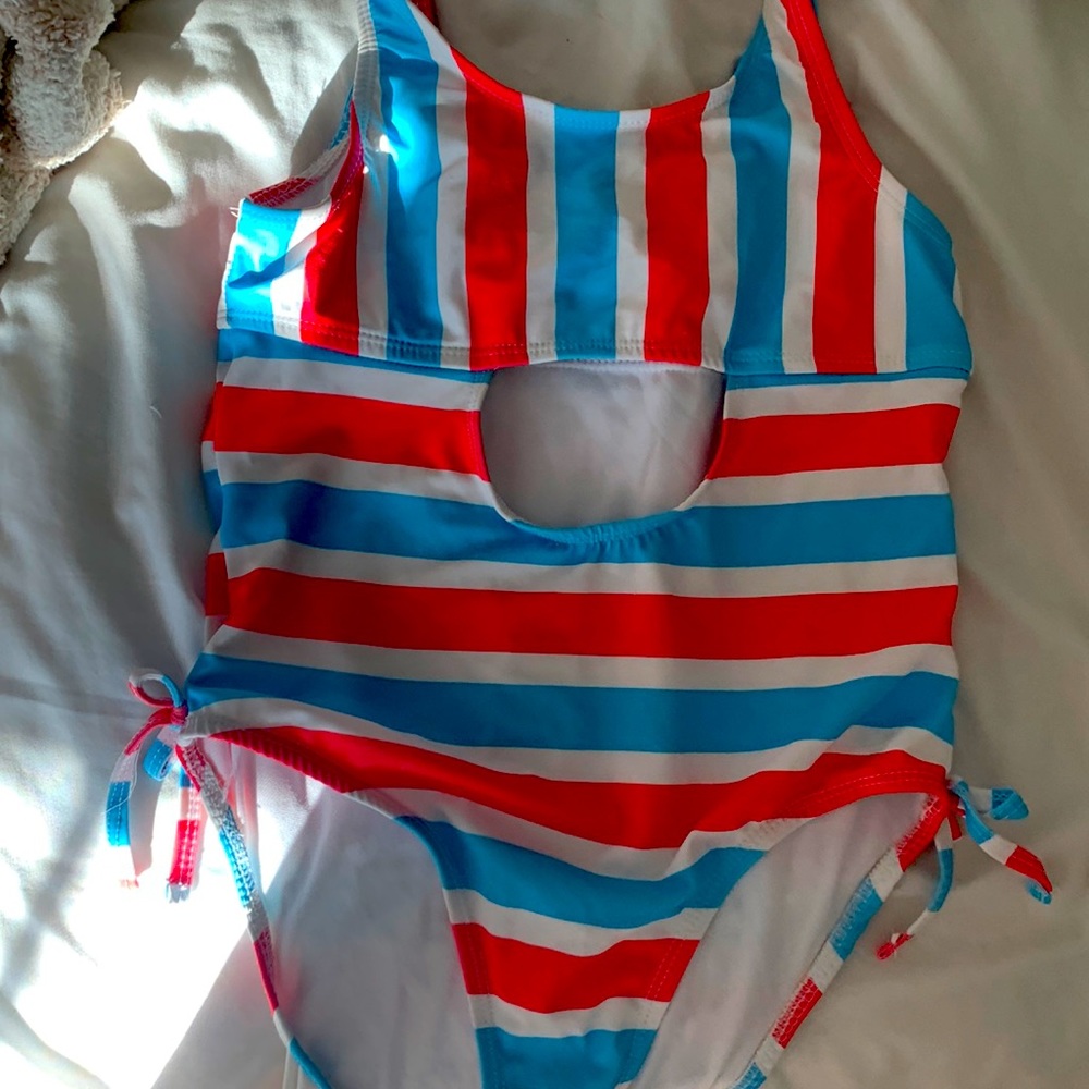 Fourth of July swimsuit with a cut out in the tummy area